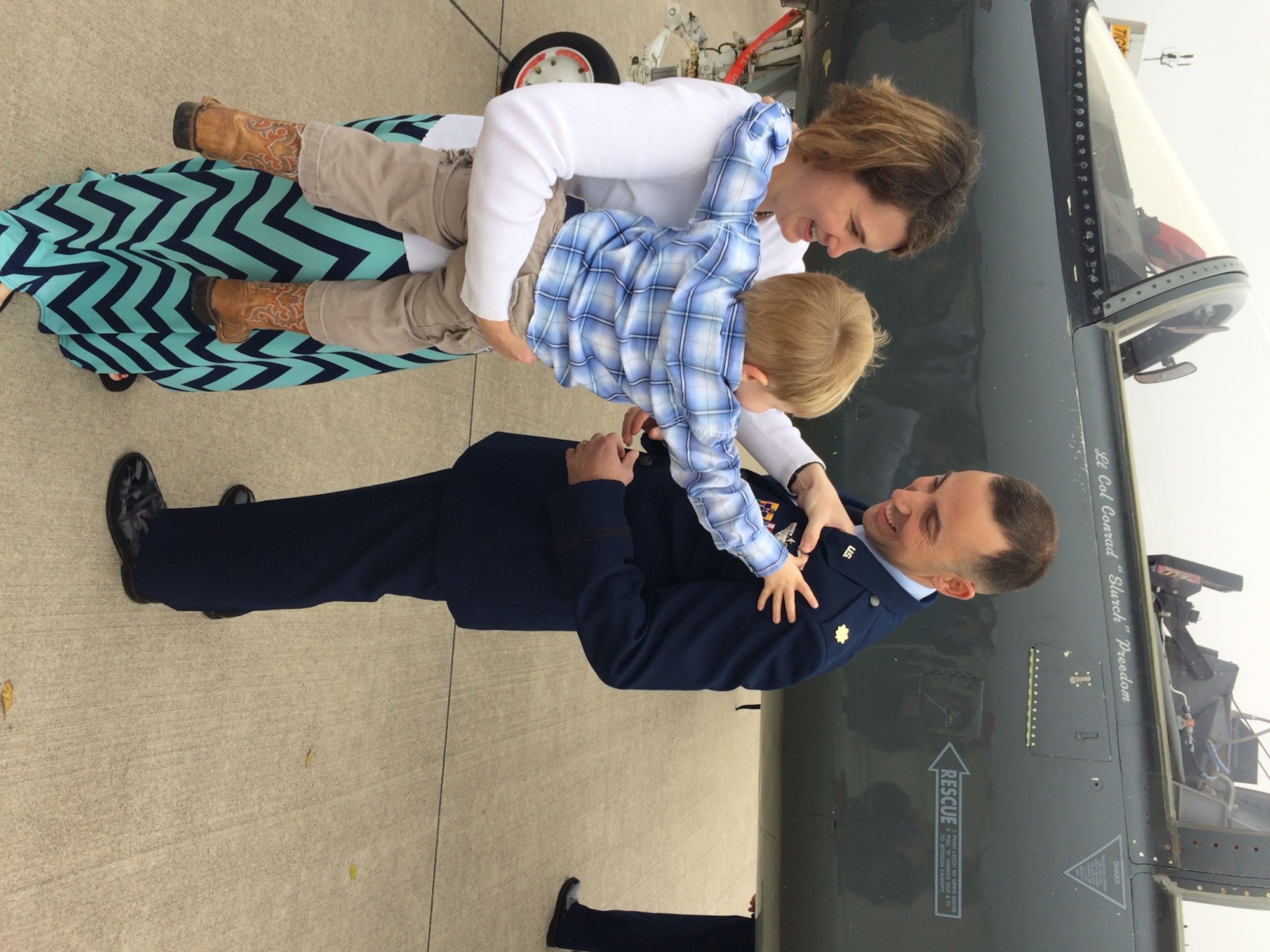 Maj. William ‘Bubba’ Pope’s wife Necia and son Tyler pin on his wings on the flight line at Laughlin Air Force Base, Texas. (Courtesy photo).