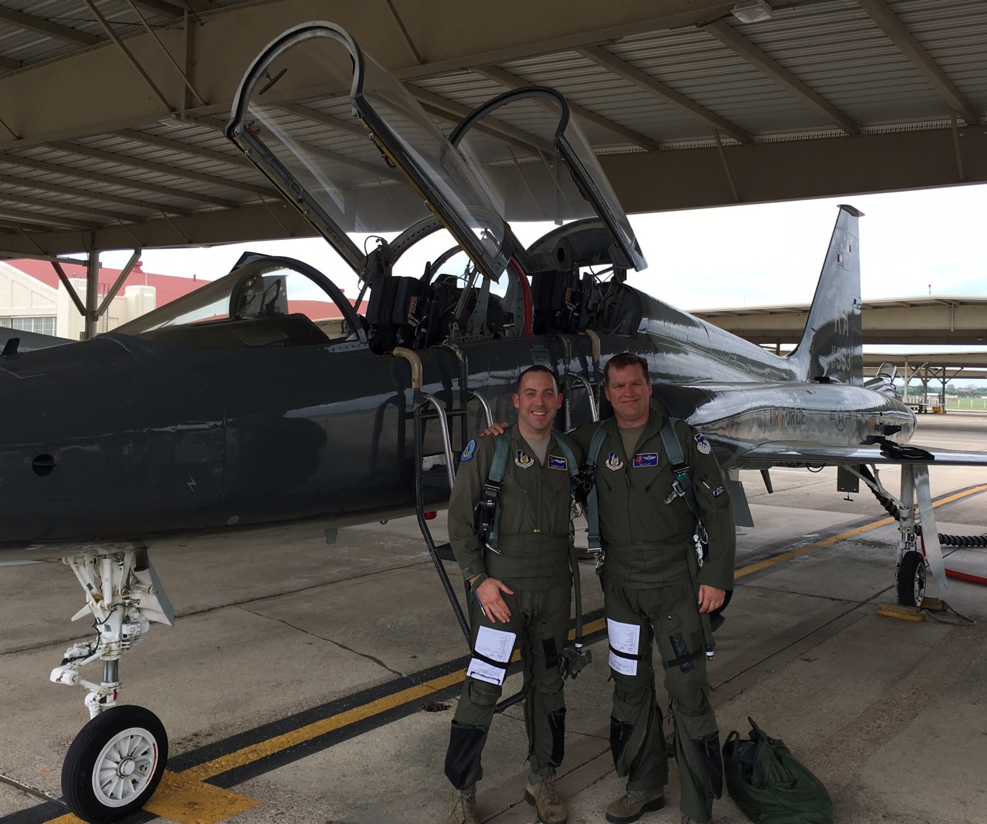 Maj. William ‘Bubba’ Pope (L) pauses for a photo with Lt. Col. Matthew ‘MIG’ Alley on the flight line at Laughlin Air Force Base, Texas. (Courtesy photo).