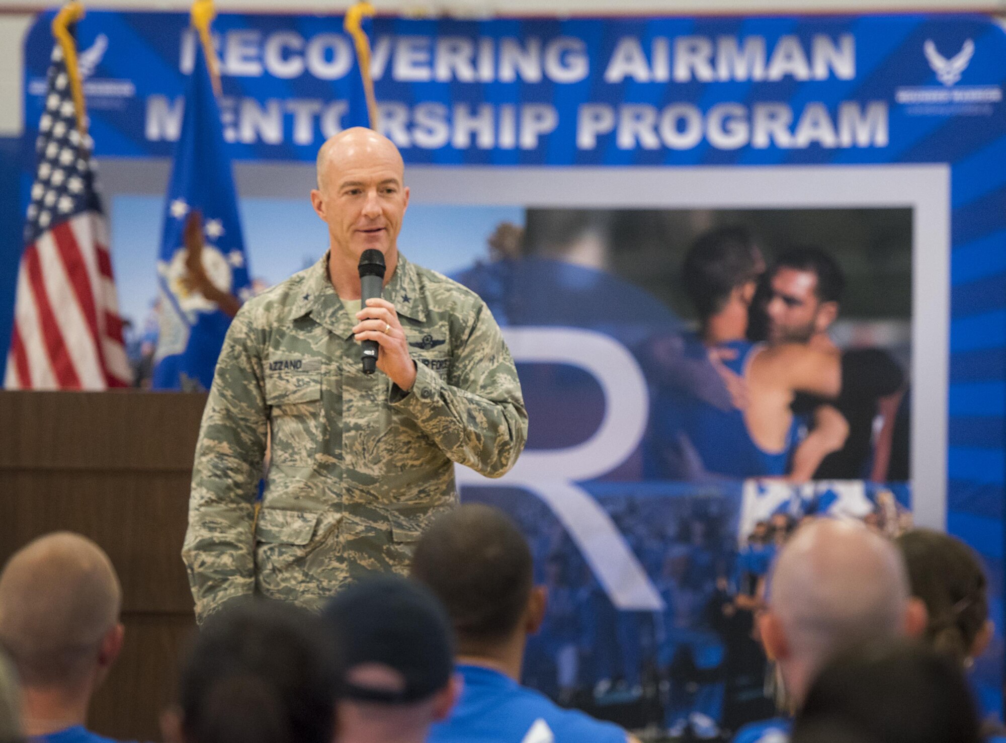 Brig. Gen. Christopher Azzano, the 96th Test Wing commander, speaks to the Warrior CARE attendees and Warrior Games athletes at the opening ceremony of the two events April 24 at Eglin Air Force Base, Fla. The ceremony kicked off a week-long rehabilitative wounded warrior camp as well as a training session for the Air Force Warrior Games athletes. (U.S. Air Force photo/Samuel King Jr.)