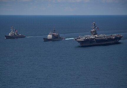 The Arleigh Burke-class guided-missile destroyer USS Michael Murphy (DDG 112), left, and the Ticonderoga-class guided-missile cruiser USS Lake Champlain (CG 57) are underway with the aircraft carrier USS Carl Vinson (CVN 70), April 14, 2017. The ships are on a scheduled western Pacific deployment with the Carl Vinson Carrier Strike Group as part of the U.S. Pacific Fleet-led initiative to extend the command and control functions of U.S. 3rd Fleet. U.S. Navy aircraft carrier strike groups have patrolled the Indo-Asia-Pacific regularly and routinely for more than 70 years.