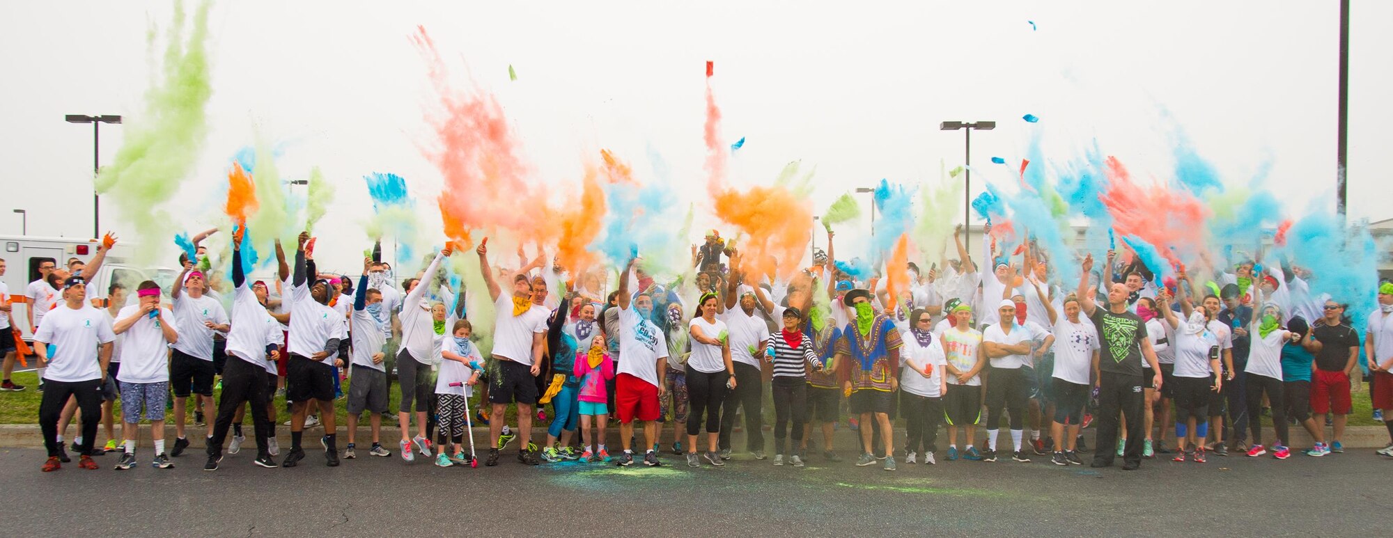 Participants of the Sexual Assault Awareness Month Color Run kick off the event by throwing colored powder into the air April 21, 2017, at Dover Air Force Base, Del. The run was one of several events hosted by the Dover AFB SAPR office during Sexual Assault Awareness Month. (U.S. Air Force photo by Mauricio Campino)