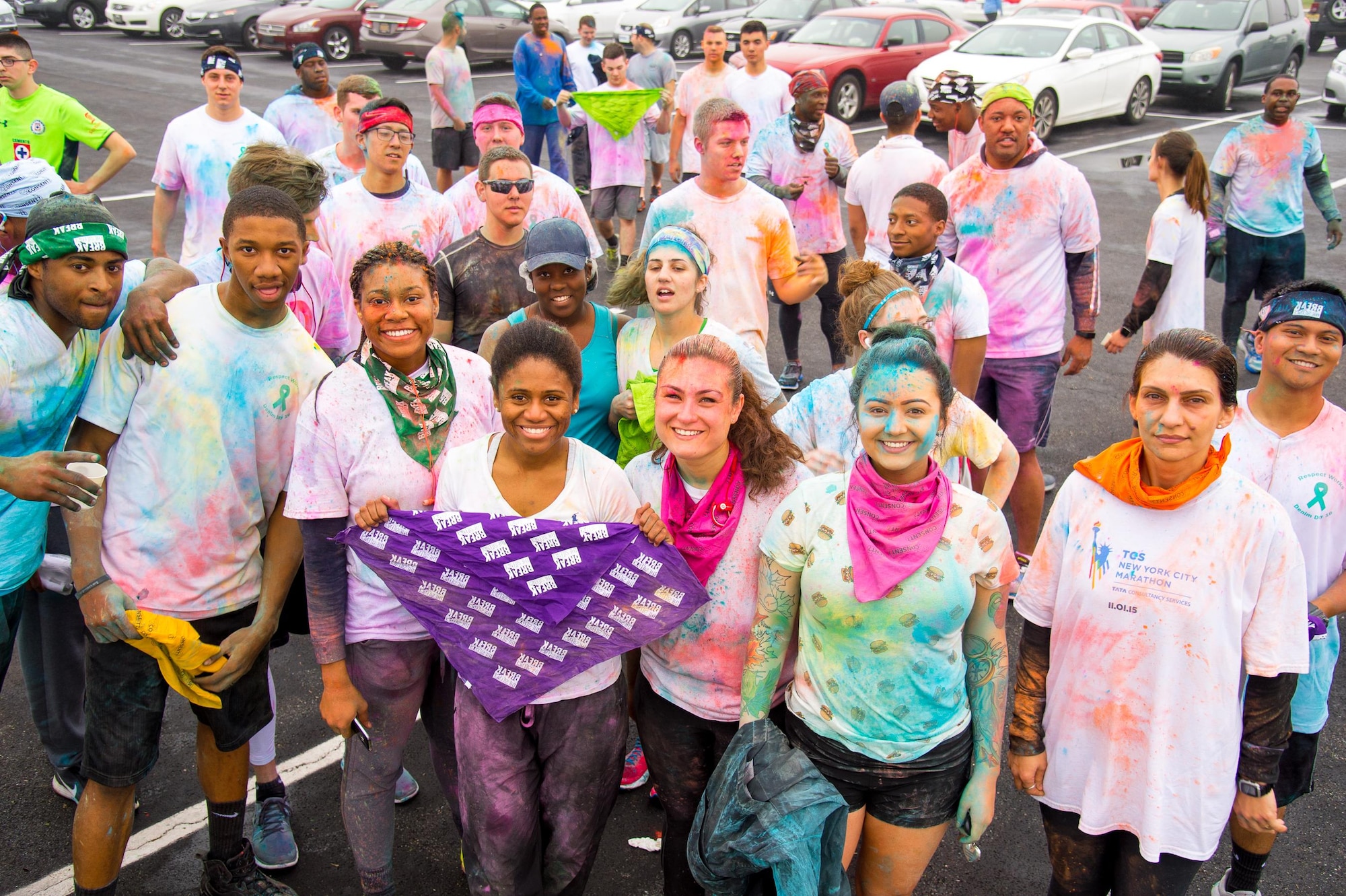 Participants of the Sexual Assault Awareness Month Color Run pose for a group photo at the finish line April 21, 2017, at Dover Air Force Base, Del. Some runners chose to run as a team while others ran individually. (U.S. Air Force photo by Mauricio Campino)