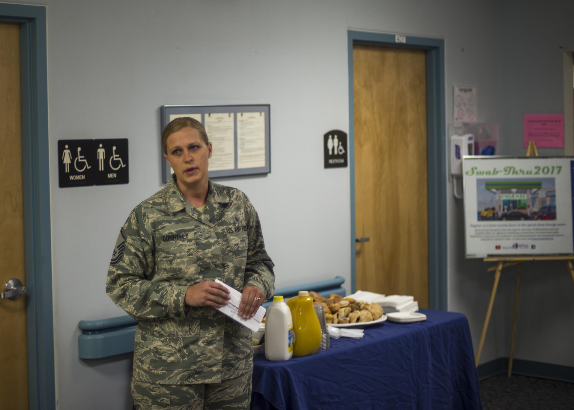 Master Sgt. Crystal Connelly, the 49th Medical Group Diagnostic and Therapeutics flight chief, addresses a room of people during the MDG's Swab-Thru event, at Holloman Air Force Base, N.M. on April 20, 2017. The Swab-Thru, coordinated with the “Salute to Life” program, is a special drive-thru bone marrow registration event. Connelly was inspired to bring the program to Holloman after her mother-in-law was diagnosed with cancer. (U.S. Air Force photo by Airman 1st Class Alexis P. Docherty)