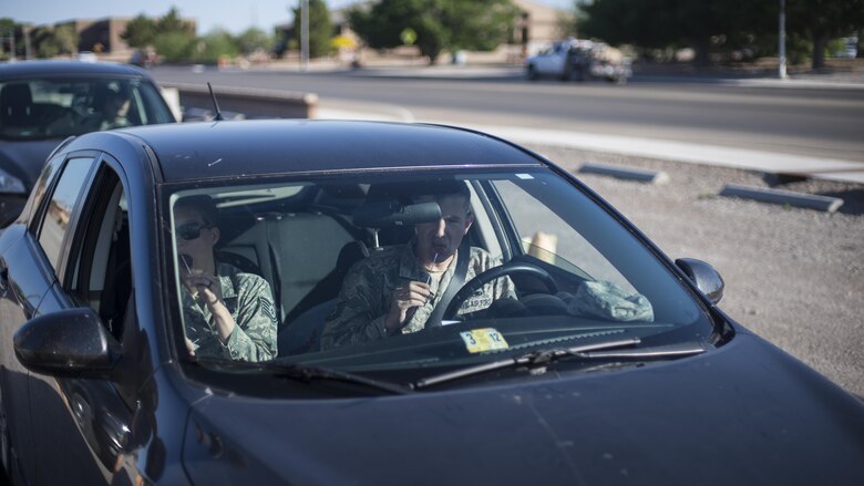 Tech. Sgt. Amanda Junk, Holloman Air Force Base command information non-commissioned officer in charge, and Tech. Sgt. Jeffry Howerton, Holloman AFB broadcast communication non-commissioned officer in charge, swab their inner cheeks during the 49th Medical Group’s Swab-Thru event, at Holloman Air Force Base, N.M. on April 20, 2017. The Swab-Thru, coordinated with the “Salute to Life” program, is a special drive-thru bone marrow registration event. “Salute to Life” is a Department of Defense Bone Marrow Donation Program. The program is used to fight against blood and bone cancer, and can help treat or cure more than 50 diseases. (U.S. Air Force photo by Airman 1st Class Alexis P. Docherty) 