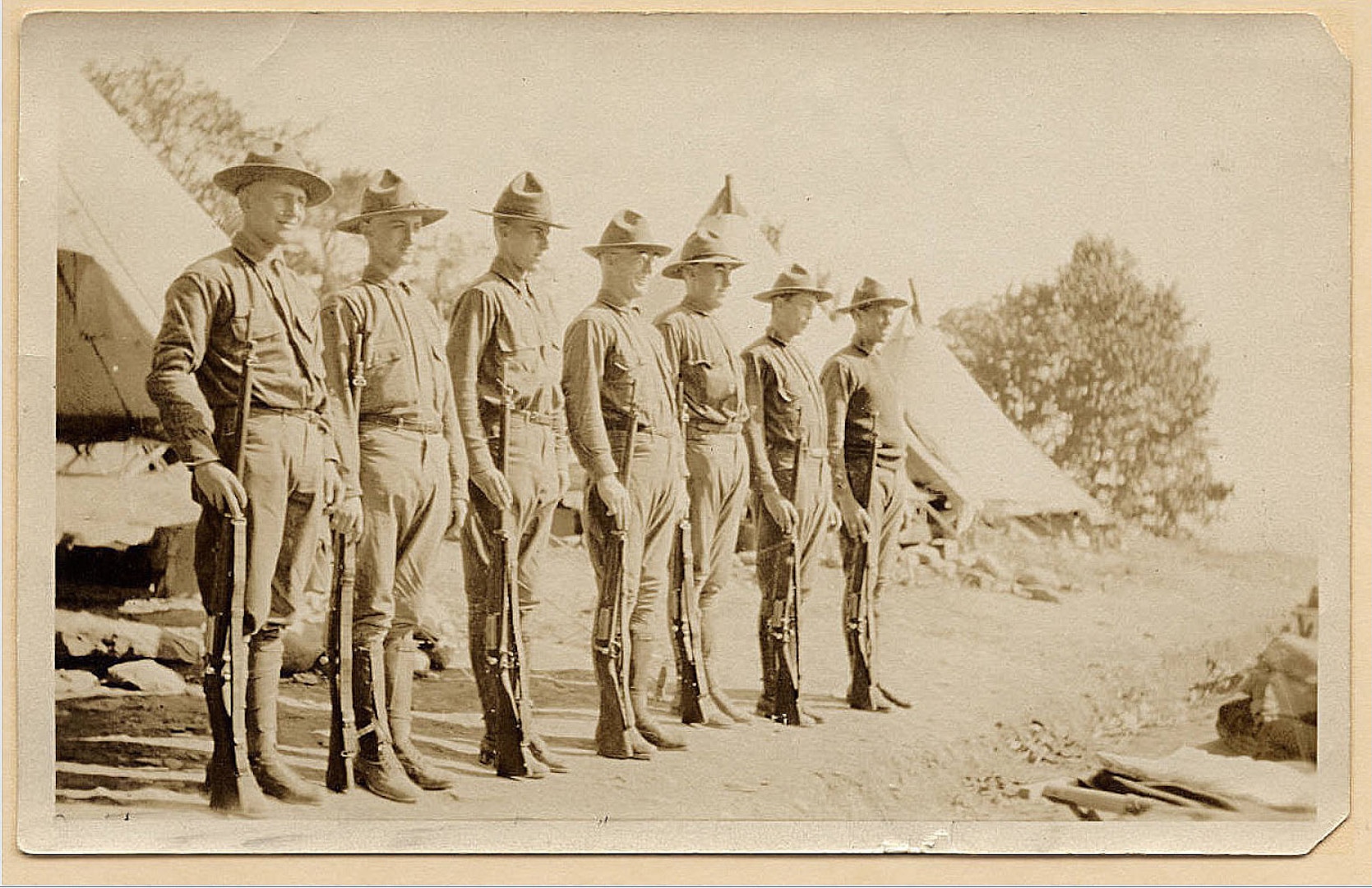 New York Guard members identified as  Jake, Jim, Garry, Dick,Tom, Bill, and Hill mount Guard near New Paltz, N.Y., sometime during 1918 in this photograph taken by Thomas F. Burke, a member of the New York Guard, the force which replaced the New York National Guard during World War I. The men guarded the 95-mile lone water line which carried water to New York City from Catskill Mountain reservoirs to protect it against German sabatoge. 