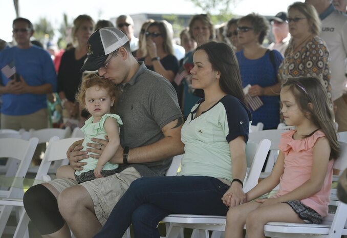 U.S. Marine Corps Lance Cpl. Jeremy Brooking, left, and his family are recognized for their sacrifices during a ground breaking ceremony facilitated by Operation Finally Home at Carnes Crossroads community, April 22, 2017, in Summerville, S.C. Brooking was injured during a deployment to Iraq in 2007 and through the efforts of Operation Finally Home and various other organizations, was given a mortgage-free house tailored to fit the family’s needs. Airmen and Sailors from Joint Base Charleston attended the event to show support to the Brooking family. 