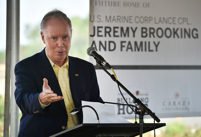 Retired U.S. Army Maj. Gen. Gerald Minetti, event keynote speaker, thanks U.S. Marine Corps Lance Cpl. Jeremy Brooking and his family for their sacrifice during a ground breaking ceremony facilitated by Operation Finally Home at Carnes Crossroads community, April 22, 2017, in Summerville, S.C. Brooking was injured during a deployment to Iraq in 2007 and through the efforts of Operation Finally Home and various other organizations, was given a mortgage-free house tailored to fit the family’s needs. Airmen and Sailors from Joint Base Charleston attended the event to show support to the Brooking family.