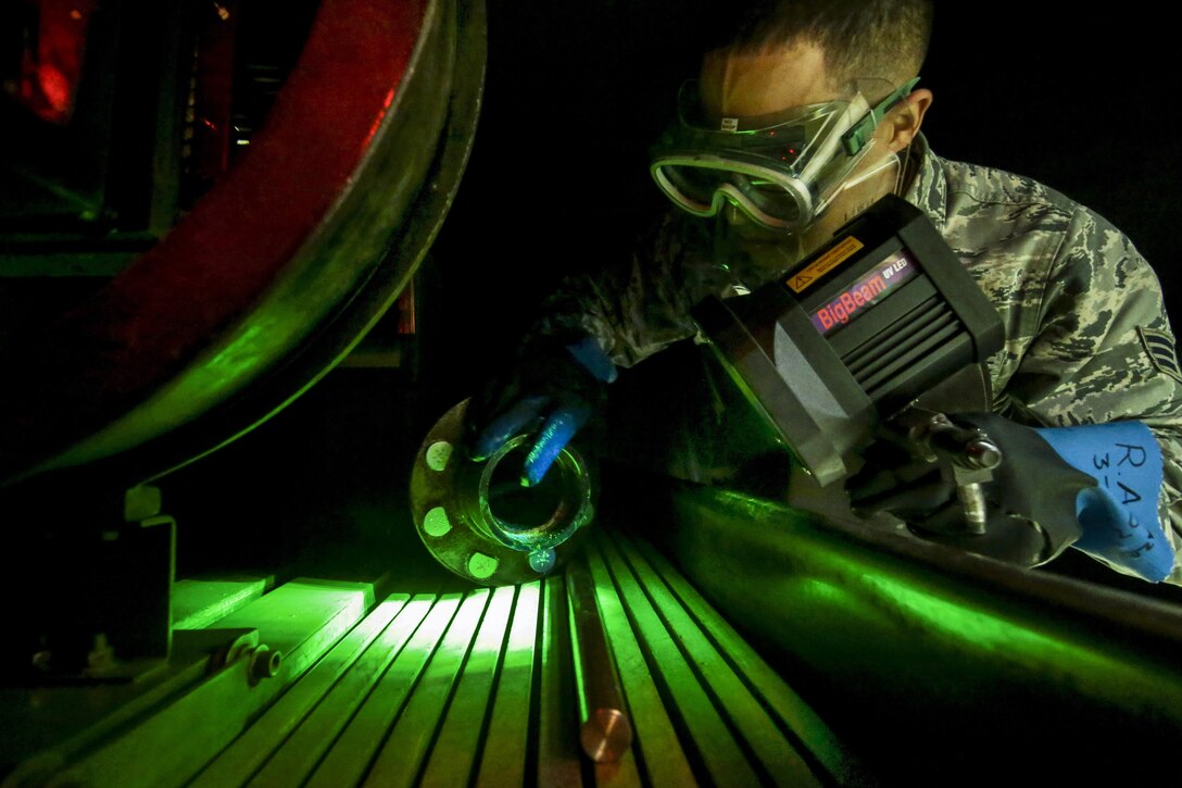Air Force Senior Airman Ronald Anazco examines a KC-135 Stratotanker part during a training session at Joint Base McGuire-Dix-Lakehurst, N.J., April 22, 2017. Anazco is assigned to the New Jersey Air National Guard’s 108th Maintenance Squadron nondestructive inspection shop. Air National Guard photo by Master Sgt. Matt Hecht/Released