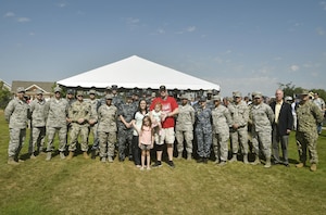 U.S. Marine Corps Lance Cpl. Jeremy Brooking, left, and his family are recognized for their sacrifices during a ground breaking ceremony facilitated by Operation Finally Home at Carnes Crossroads community, April 22, 2017, in Summerville, S.C. Brooking was injured during a deployment to Iraq in 2007 and through the efforts of Operation Finally Home and various other organizations, was given a mortgage-free house tailored to fit the family’s needs. Airmen and Sailors from Joint Base Charleston attended the event to show support to the Brooking family. (U.S. Air Force photo by Staff Sgt. Christopher Hubenthal)