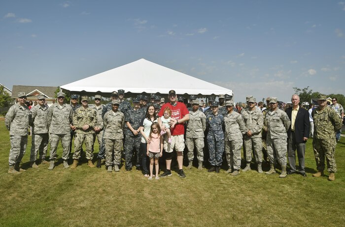 U.S. Marine Corps Lance Cpl. Jeremy Brooking, left, and his family are recognized for their sacrifices during a ground breaking ceremony facilitated by Operation Finally Home at Carnes Crossroads community, April 22, 2017, in Summerville, S.C. Brooking was injured during a deployment to Iraq in 2007 and through the efforts of Operation Finally Home and various other organizations, was given a mortgage-free house tailored to fit the family’s needs. Airmen and Sailors from Joint Base Charleston attended the event to show support to the Brooking family. (U.S. Air Force photo by Staff Sgt. Christopher Hubenthal)