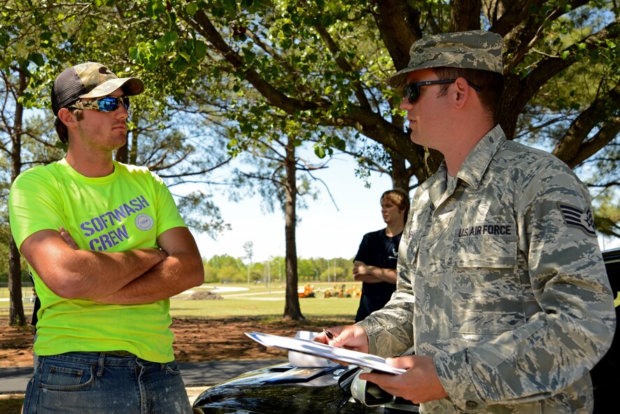 U.S. Air Force Staff Sgt. Brian Rash, 337th Recruiting Squadron recruiter, right, speaks to James Lock, a recruit, left, during a Delayed Entry Program (DEP) call at Dillon Park in Sumter, S.C., April 11, 2017. DEP members attend calls monthly and are briefed on what they can expect during Basic Military Training and as Airmen. (U.S. Air Force photo by Airman 1st Class Kathryn R.C. Reaves)