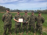 Colonel Jason L. Morris, 9th Marine Corps District commanding officer, awards Staff Sgt. Kevin J. Brau, the staff noncommissioned officer of Recruiting Substation South Bend, Recruiting Station Indianapolis, April 22, in South Bend, Indiana, as the SNCOIC champion of Operation Gridiron Blitz. Operation Gridiron Blitz was a 9th Marine Corps District recruiting offensive that tasked Marine recruiters to find the next  smart, tough and elite warriors to serve in the Marine Corps. Brau said his Marines, pictured left to right, Sgt. Brant Scherbarth, Sgt. Brandon Weaver, Staff Sgt. Korey Lewis and, not pictured, Sgt. Franklin Alvarado, were the sole reason why he won the award. Brau said he "owes everything to the Marines who went out and accomplished the mission. They were the ones who brought in the men and women who are of the highest caliber to the RSS pool team." Morris presented the award to Brau prior to a pool function, where he, his Marines and the men and women in the delayed entry program, or DEP, conducted a mud run for their monthly pool function.