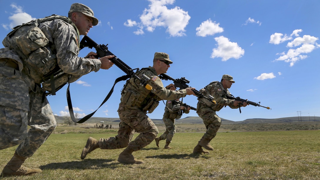 Soldiers bound forward during a squad movement exercise at the Yakima Training Center in Washington, April 21, 2017. The soldiers are assigned to the 20th Chemical, Biological, Radiological, Nuclear and Explosives Command. Army photo by Sgt. Kalie Jones