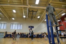 Teams compete during a volleyball game at the base fitness center during sports day April 21, 2017, at Malmstrom Air Force Base, Mont. Throughout the day, teams were awarded points depending on how they placed in each sporting event. (U.S. Air Force photo/Airman 1st Class Daniel Brosam)