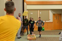 Senior Master Sgt. Daniel Doble, 341st Comptroller Squadron and Wing Staff Agency superintendent, tosses a bag during a game of cornhole April 21, 2017, at Malmstrom Air Force Base, Mont. WSA placed second with a combined 60 points. (U.S. Air Force photo/Airman 1st Class Daniel Brosam)