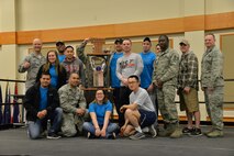 Col. Jay Folds, 341st Missile Wing vice commander, left, poses with Airmen from the 341st Force Support Squadron April 21, 2017, at Malmstrom Air Force Base, Mont. The 341st FSS team won first place during sports day and earned a trophy that will stay in their possession until the next sports day. (U.S. Air Force photo/Airman 1st Class Daniel Brosam)