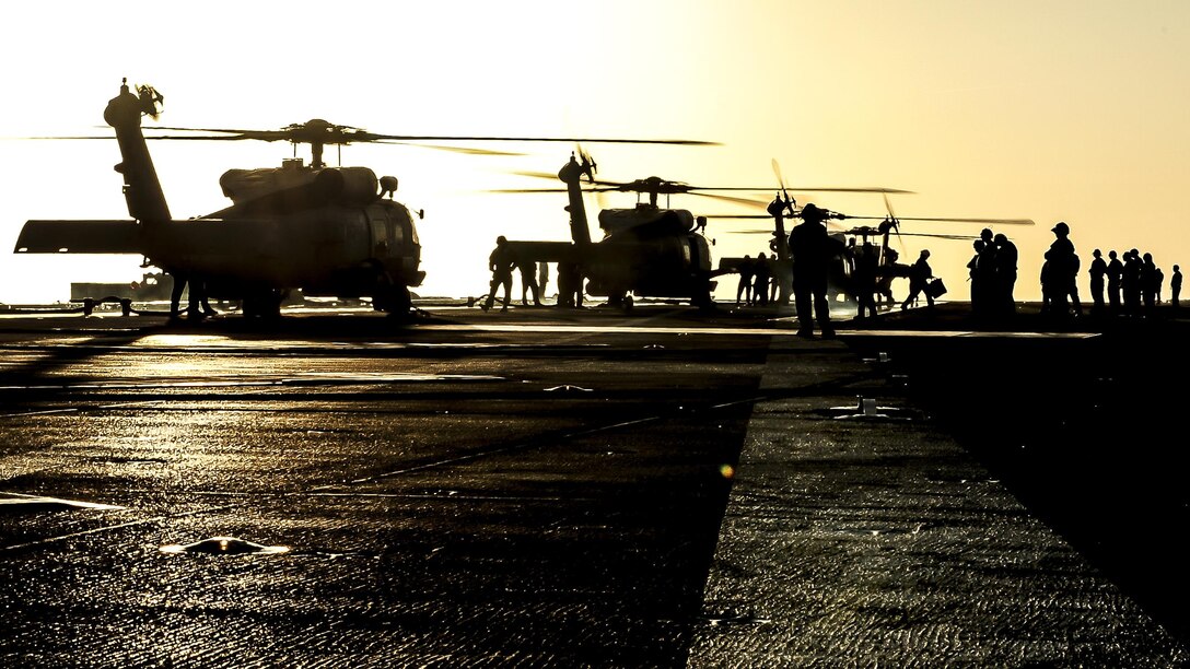 MH-60 Seahawk helicopters prepare to take off from the flight deck of the USS Theodore Roosevelt in the Pacific Ocean, April 21, 2017. The aircraft carrier is conducting training off the coast of California. Navy photo by Petty Officer 3rd Class Spencer Roberts