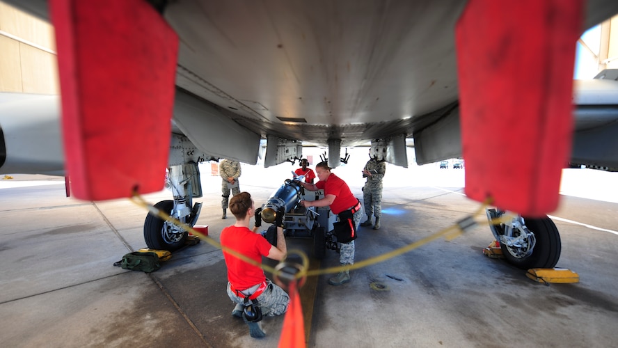 U.S. Airmen, assigned to the 924th Aircraft Maintenance Unit, load a Guided Bomb Unit-38 onto an A-10C Thunderbolt II during a load crew of the quarter competition at Davis-Monthan Air Force Base, Ariz., April 21, 2017. The quarterly events allow Airmen to exhibit their teamwork on a competitive platform, while providing conditions to spark the sense of urgency and attention to detail that are imperative for Airmen to destroy enemies downrange. (U.S. Air Force photo by Airman 1st Class Nathan H. Barbour