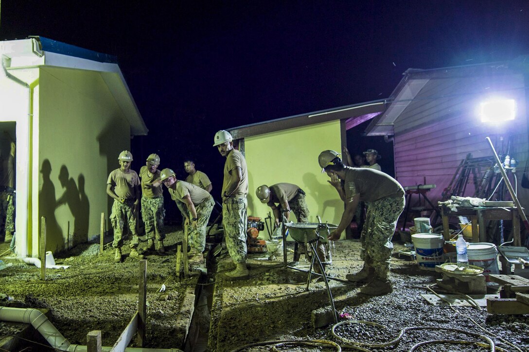Sailors work on renovations at Sungai Pinang Primary School in Kuching, Malaysia, April 17, 2017, as part of the Pacific Partnership 2017 humanitarian assistance and disaster relief preparedness mission. The sailors are Seabees assigned to Naval Mobile Construction Battalion 3. Navy photo by Petty Officer 2nd Class Chelsea Troy Milburn