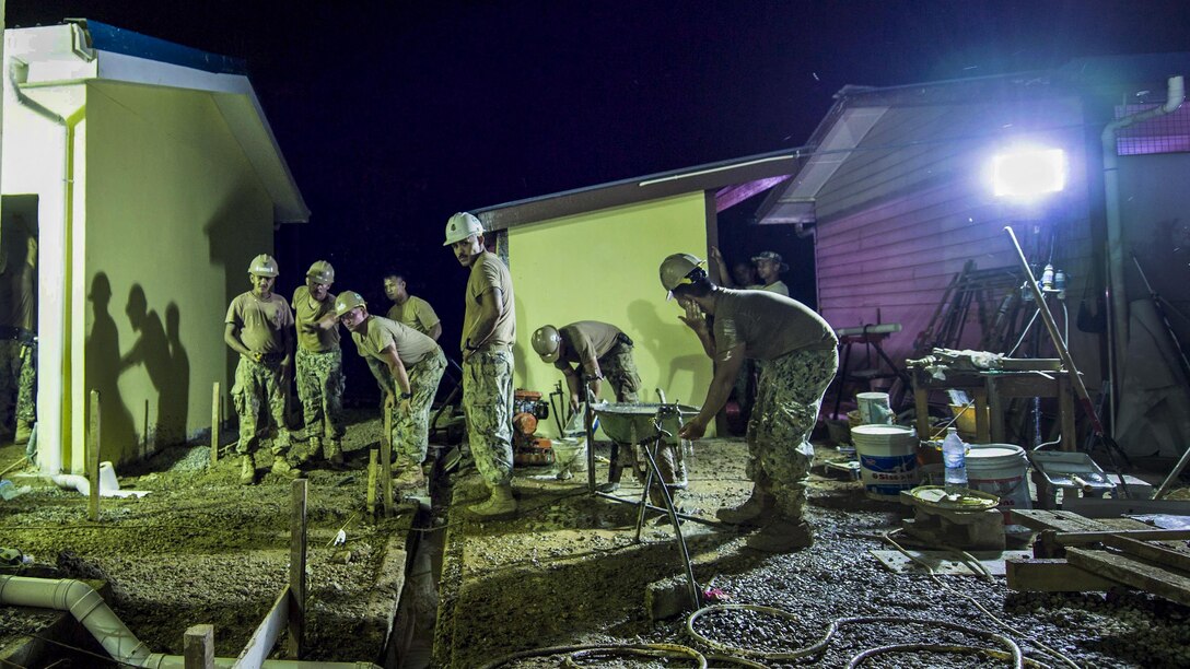 Sailors work on renovations at Sungai Pinang Primary School in Kuching, Malaysia, April 17, 2017, as part of the Pacific Partnership 2017 humanitarian assistance and disaster relief preparedness mission. The sailors are Seabees assigned to Naval Mobile Construction Battalion 3. Navy photo by Petty Officer 2nd Class Chelsea Troy Milburn