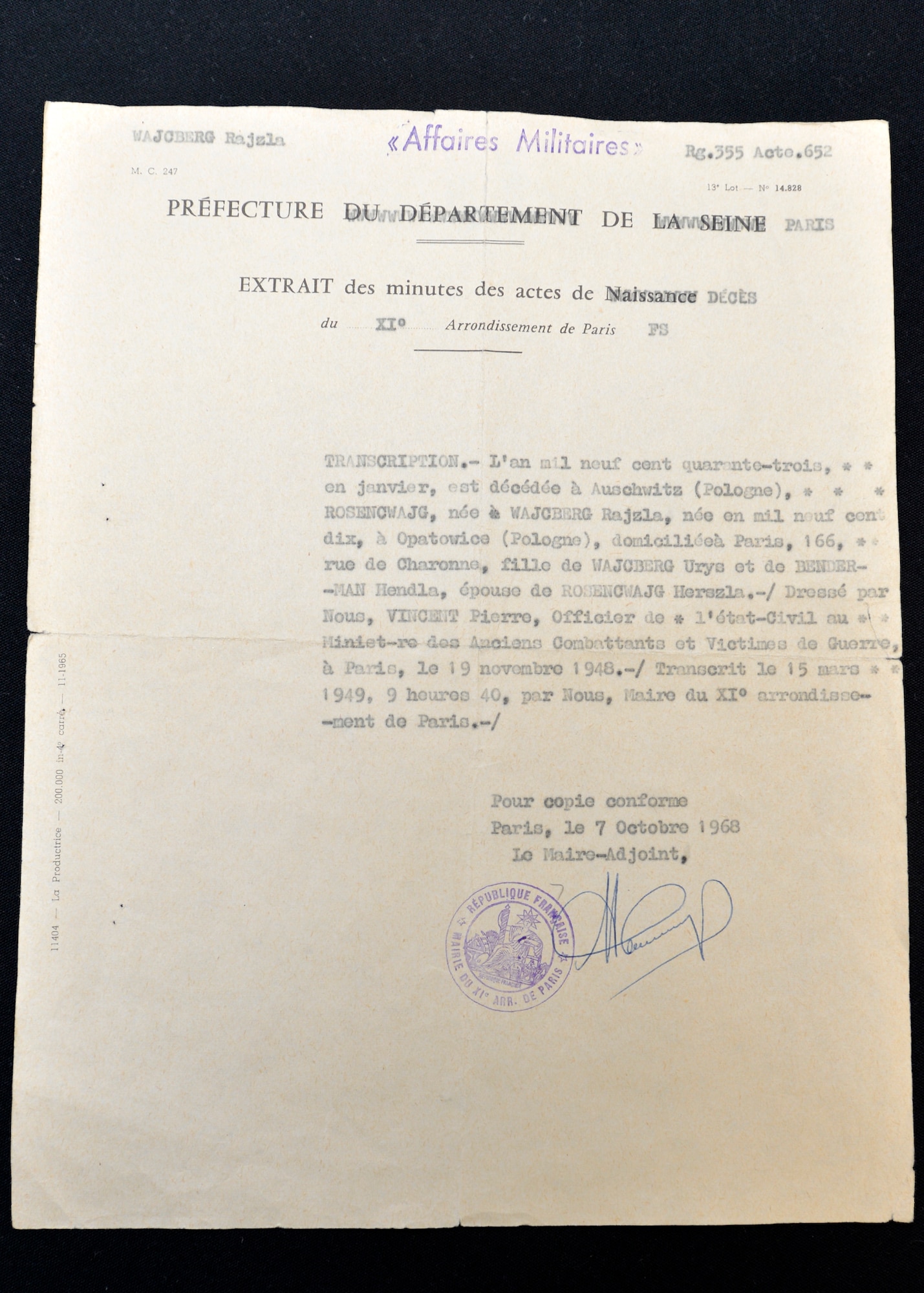 Charlotte Adelman received this document from officials at the Auschwitz Concentration Camp informing her of her mother’s death in 1943. Adelman shared her story as a child holocaust survivor during the 56th Fighter Wing’s Days of Remembrance April 20, 2017 at Luke Air Force Base. (U.S. Air Force photo by Staff Sgt. Marcy Copeland) 