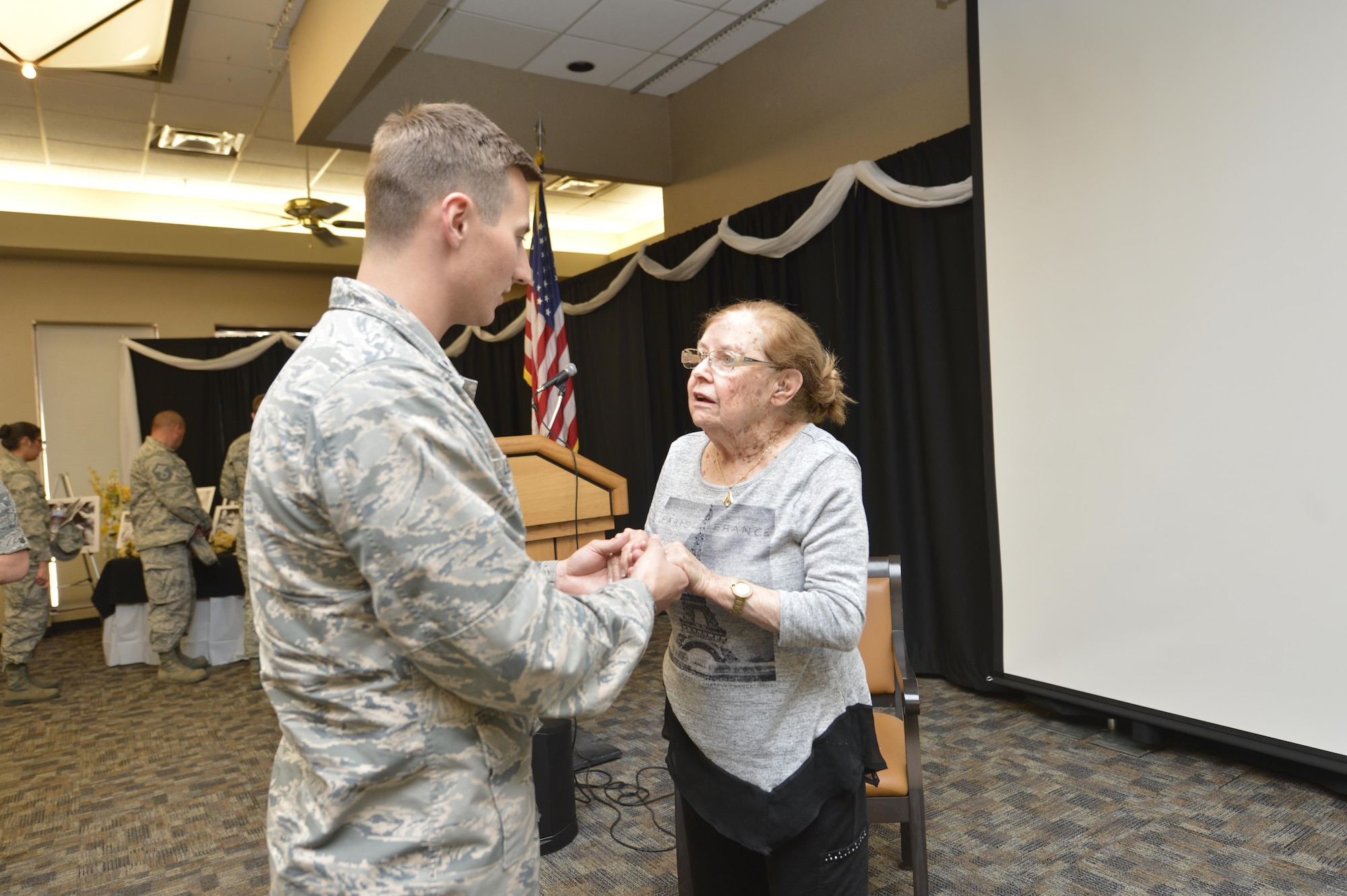 Charlotte Adelman meets with Airmen during the Days of Remembrance April 20, 2017. Honoring the memory of the lives lost during the atrocities of the Holocaust, Adelman shared her story of survival as a child during the Holocaust. (U.S. Air Force photo by Staff Sgt. Marcy Copeland)
