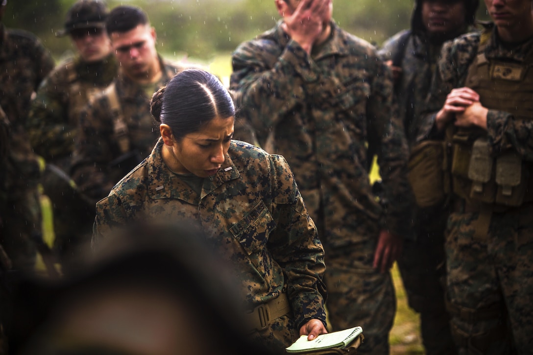 2nd Lt. Jennifer N. Galvan gives a mission brief during a Marine Corps Combat Readiness Evaluation at Central Training Area, Camp Hansen, Okinawa, Japan, April 18, 2017. 3d Law Enforcement Battalion conducted the evaluation to test each company’s ability to execute tasks ranging from policing operations to police patrolling, route regulations, key leader engagements in towns and local population centers, and security of key infrastructure in an expeditionary environment, to ensure they are prepared to support the operational requirements of III Marine Expeditionary Force. Galvan, a native of Oak Lawn, Ill., is a platoon commander for Bravo Company, 3d LE Bn., III MEF Headquarters Group. (U.S. Marine Corps photo by Lance Cpl. Joshua Pinkney)
