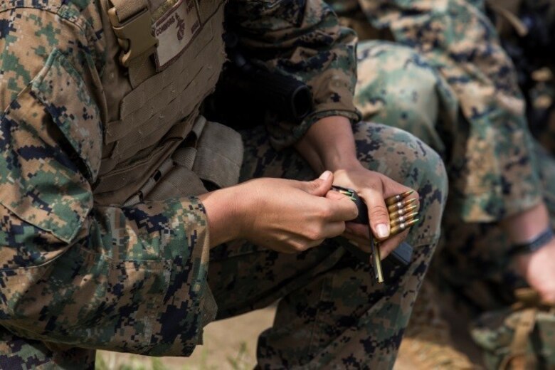MARINE CORPS BASE HAWAII – Sgt. Shannon Connors, a distribution management specialist with Headquarters Battalion, loads rounds into a magazine during the unit’s annual training qualification for Table Five at Kaneohe Bay Range Training Facility aboard MCB Hawaii on March 15, 2017. Headquarters Bn. is conducting the training in order to meet the Marine Corps’ requirement that every unit must complete Tables Three through Six to better prepare Marines for combat. (U.S. Marine Corps photo by Lance Cpl. Isabelo Tabanguil)