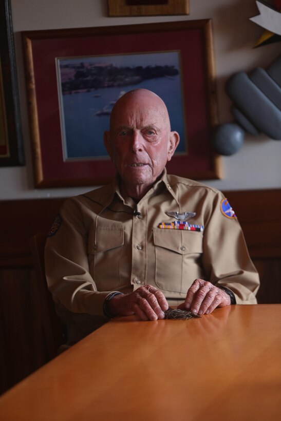 MARINE CORPS BASE HAWAII – Jeremy Yellin, a former fighter pilot in the Army Air Corps, shares his story to service members and DoD employees at the Officers Club aboard Marine Corps Base Hawaii, March 16, 2017. Yellin, a World War II veteran, was giving beads by a Muslim doctor at the Burlington Regional Hospital in Burlington, Iowa. (U.S. Marine Corps photo by Cpl. Zachary Orr)