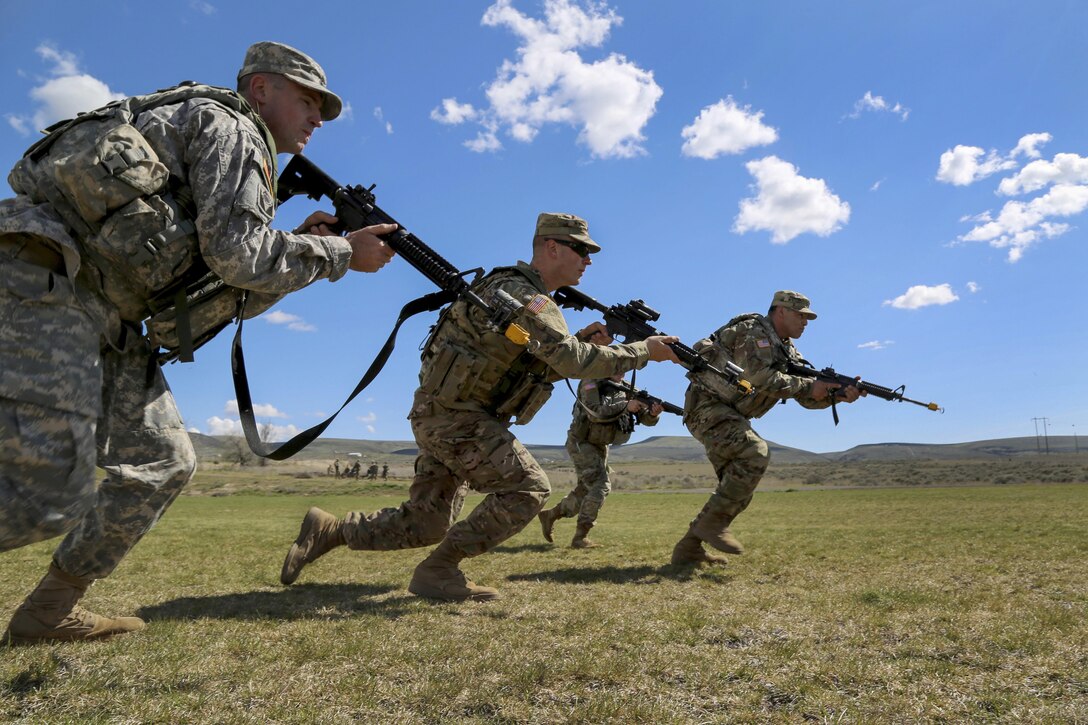 Soldiers bound forward during a squad movement exercise at the Yakima Training Center in Washington, April 21, 2017. The soldiers are assigned to the 20th Chemical, Biological, Radiological, Nuclear and Explosives Command. Army photo by Sgt. Kalie Jones