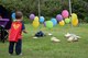 A child, who received 10 days of care from Camp Foster’s Neonatal Intensive Care Unit approaches balloons April 23, 2017, at Kadena Air Base, Japan. Each balloon attached to a goody-bag was gifted to a child whose life was saved by the NICU. (U.S. Air Force photo by Senior Airman John Linzmeier)