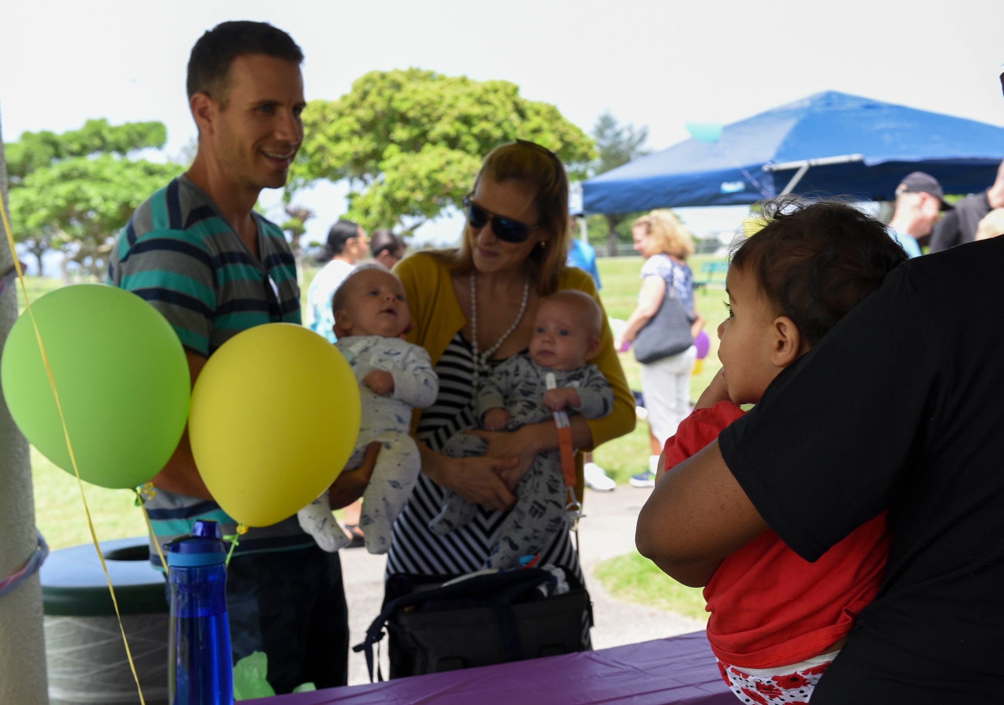 Families who received support from Camp Foster’s Neonatal Intensive Care Unit participate in the NICU’s annual reunion April 23, 2017, at Kadena Air Base, Japan. Camp Foster's NICU provides around-the-clock care for newborn infants on Okinawa, as well as those at other Pacific Air Forces locations whose needs can't be met by facilities at their home base. (U.S. Air Force photo by Senior Airman John Linzmeier)