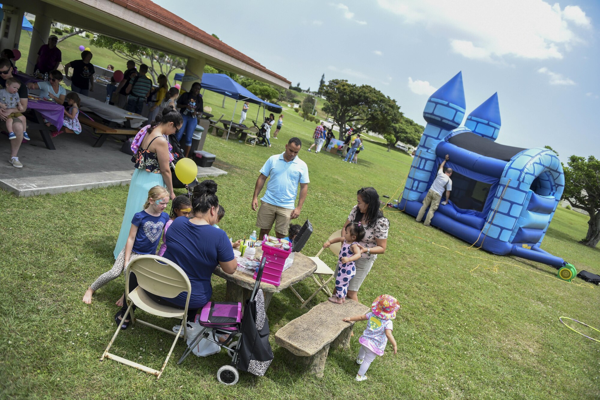Children receive face paint during the annual Neonatal Intensive Care Unit reunion April 23, 2017, at Kadena Air Base, Japan. The NICU provides 24-hour observation and care for prematurely born infants and takes care of an average of five patients daily. (U.S. Air Force photo by Senior Airman John Linzmeier)