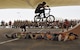 Mykel Larrin, a Bikes Over Baghdad BMX rider, jumps over service members at Al Udeid Air Base, Qatar, April 20, 2017. Bikes Over Baghdad is a professional team of BMX Riders who travel throughout the U.S. Central Command area of responsibility putting on shows for service members. (U.S. Air Force photo by Senior Airman Cynthia A Innocenti)