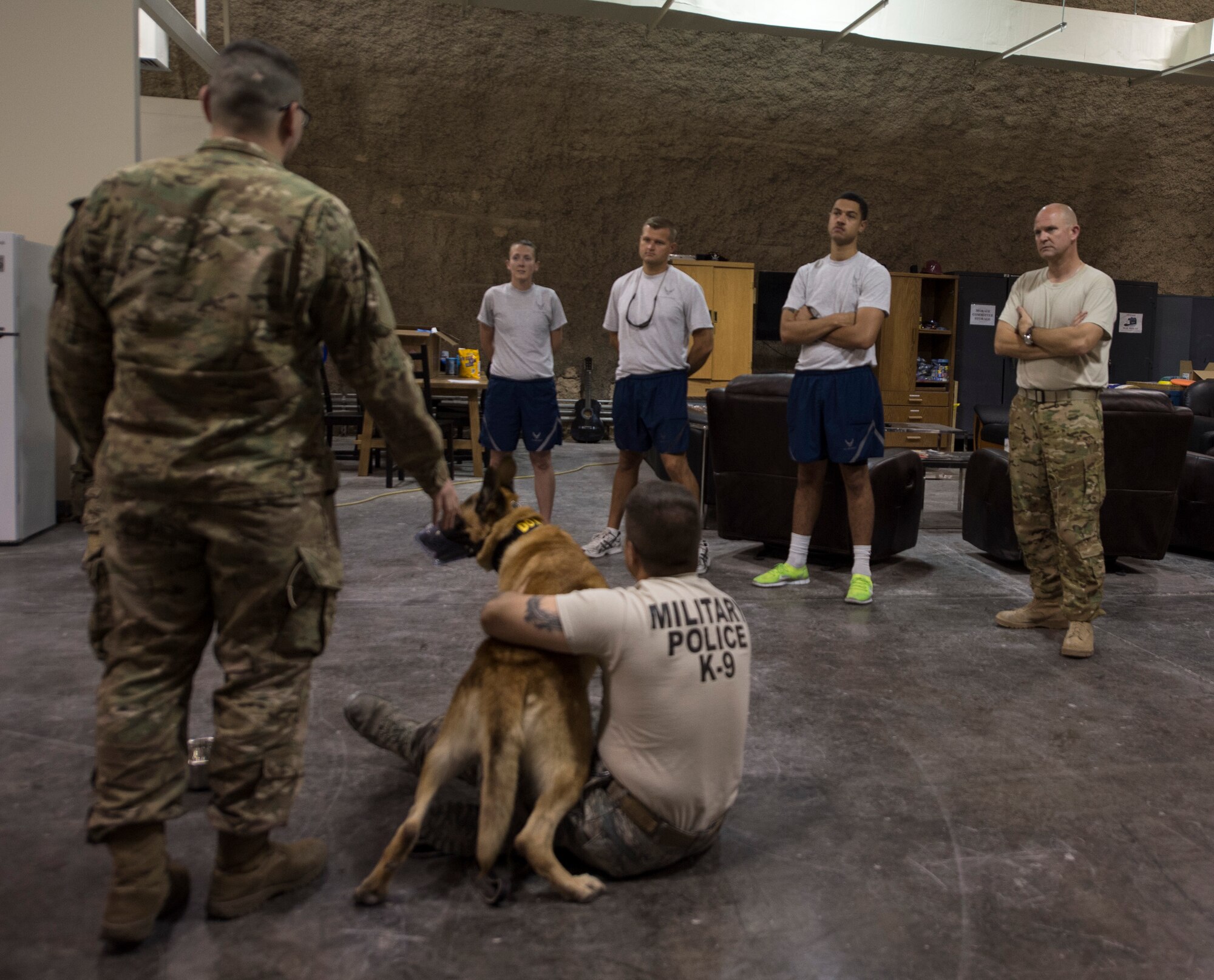 U.S. Army Spc. Ian Orourke, left, 195th Medical Detachment Veterinary Support Services, gives a class at Al Udeid Air Base, Qatar, April 19, 2017. U.S. Air Force Airmen from the 379th Expeditionary Aeromedical Evacuation Squadron attended the class in order to gain a better understanding of a military working dog anatomy so they can help in the event that no veterinary medical staff is available. (U.S. Air Force photo by Tech. Sgt. Amy M. Lovgren)