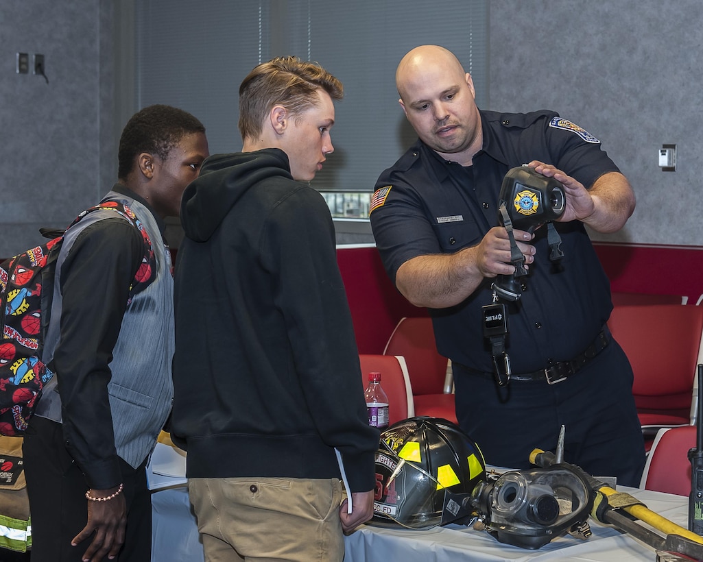 Local high school students learn about becoming a DLA police officer during a mini career fair held on Apr. 20.