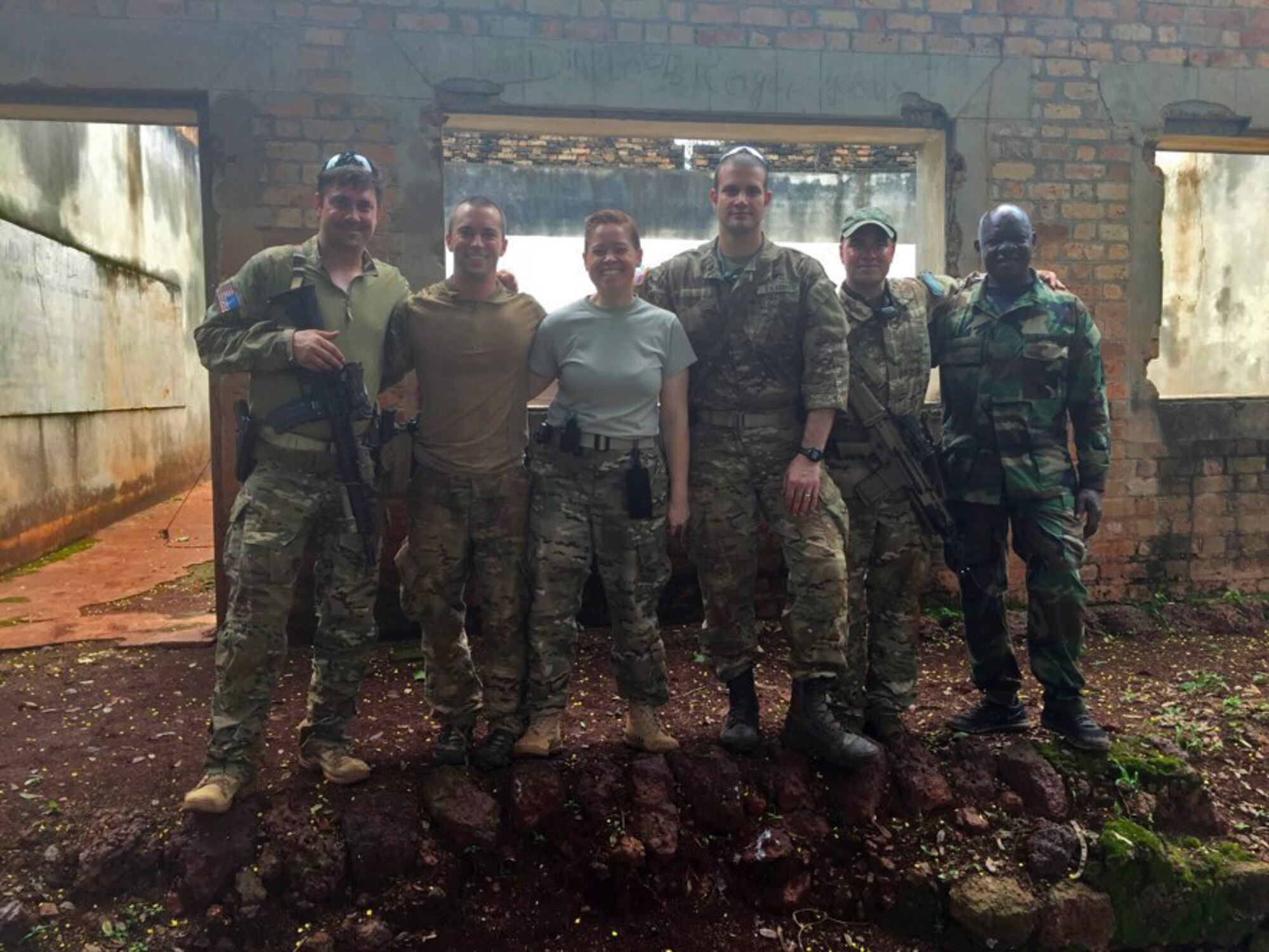 U.S. Air Force Capt. (Dr.) Eva Chatman, 20th Medical Group family health physician, center, stands with others during her deployment at an undisclosed location in Africa circa 2016. During the deployment, Chatman was responsible for the care of approximately 250 service members and federal employees. (Courtesy photo)