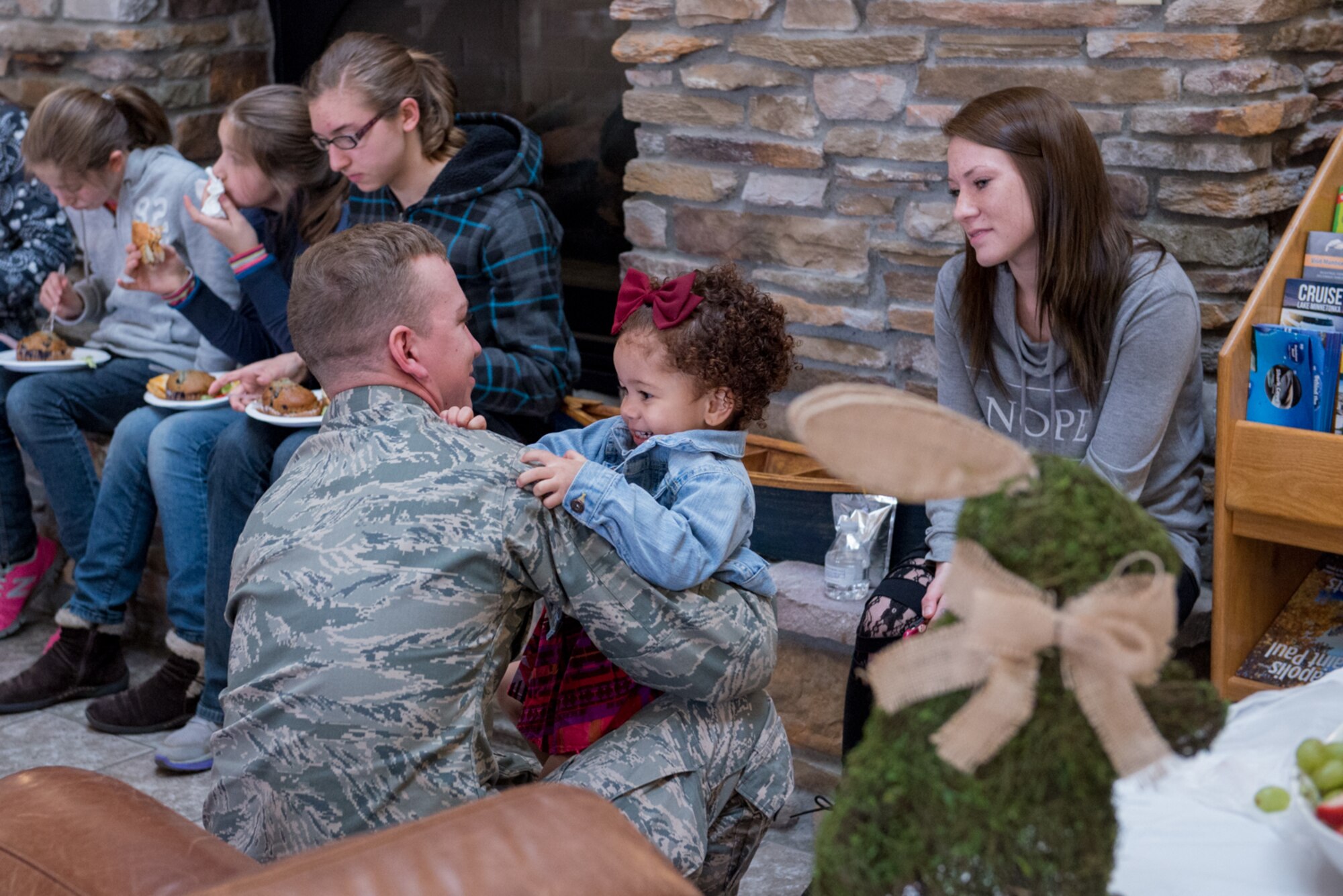 Staff Sgt. Chris Ruter, 934th Communications Squadron, and family members, wife Ashley and daughter Violet, prepare to hunt Easter eggs during the Key Supporters 2nd annual Easter egg hunt April 1 at Minneapolis-St. Paul Air Reserve Station, Minn. (U.S. Air Force photo by Senior Airman Samuel Wacha)
