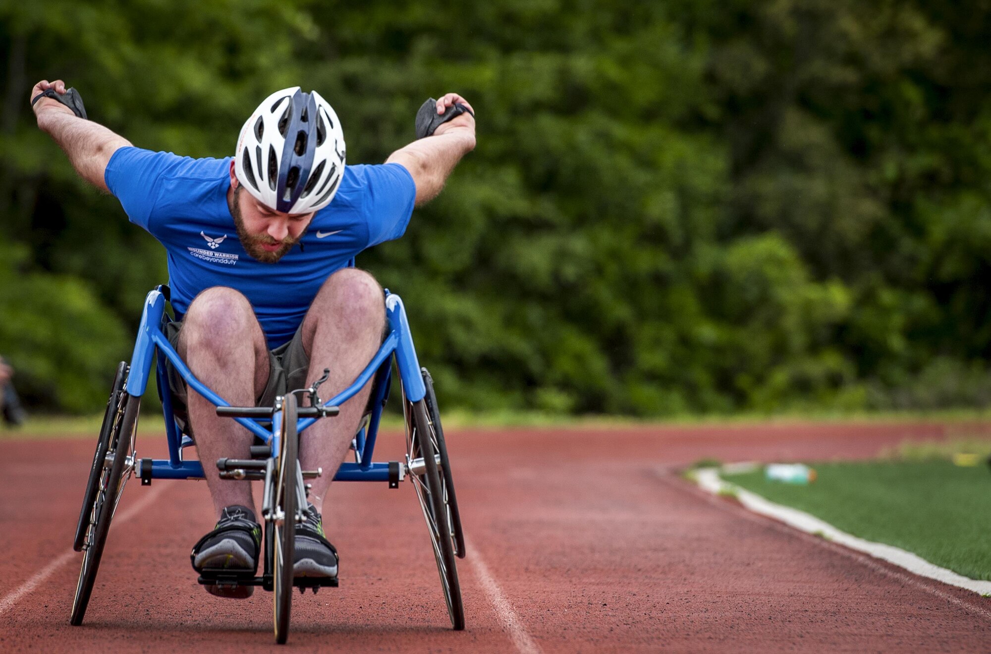 Airman 1st Class John Lemoine, a Warrior Games athlete, pushes through a roll in his sports chair a morning track and field session at the Air Force team’s training camp at Eglin Air Force Base, Fla., April 24. The base-hosted, week-long Warrior Games training camp is the last team practice session before the yearly competition in June. (U.S. Air Force photo/Samuel King Jr.)