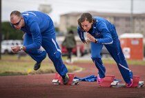 Linn Knight, a Warrior Games athlete (right), breaks into a sprint during a morning track and field session at the Air Force team’s training camp at Eglin Air Force Base, Fla., April 24. The base-hosted, week-long Warrior Games training camp is the last team practice session before the yearly competition in June. (U.S. Air Force photo/Samuel King Jr.)