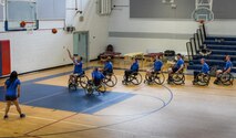 A line of Warrior CARE athletes line up to take their shot during a wheelchair basketball session at the adaptive sports camp at Eglin Air Force Base, Fla., April 24. The base hosts the week-long Wound Warrior CARE event that helps recovering wounded, ill and injured military members through specific hand-on rehabilitative training. (U.S. Air Force photo/Samuel King Jr.)