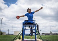 Raviro Mutumhe, a Warrior CARE athlete, winds up to throw the discus at a track and field session at the adaptive sports camp at Eglin Air Force Base, Fla., April 24. The base hosts the week-long Wound Warrior CARE event that helps recovering wounded, ill and injured military members through specific hand-on rehabilitative training. (U.S. Air Force photo/Samuel King Jr.)