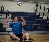Jeremy Pye, a Warrior CARE athlete, prepares to serve during a sitting volleyball session at the adaptive sports camp at Eglin Air Force Base, Fla., April 24. The base hosts the week-long Wound Warrior CARE event that helps recovering wounded, ill and injured military members through specific hand-on rehabilitative training. (U.S. Air Force photo/Samuel King Jr.)