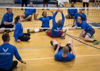 Warrior CARE athletes try to keep the ball in the air during a sitting volleyball session at the adaptive sports camp at Eglin Air Force Base, Fla., April 24. The base hosts the week-long Wound Warrior CARE event that helps recovering wounded, ill and injured military members through specific hand-on rehabilitative training. (U.S. Air Force photo/Samuel King Jr.)
