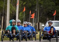 Warrior CARE athletes ride recumbent bicycles at a cycling session at the adaptive sports camp at Eglin Air Force Base, Fla., April 24. The base hosts the week-long Wound Warrior CARE event that helps recovering wounded, ill and injured military members through specific hand-on rehabilitative training. (U.S. Air Force photo/Samuel King Jr.)