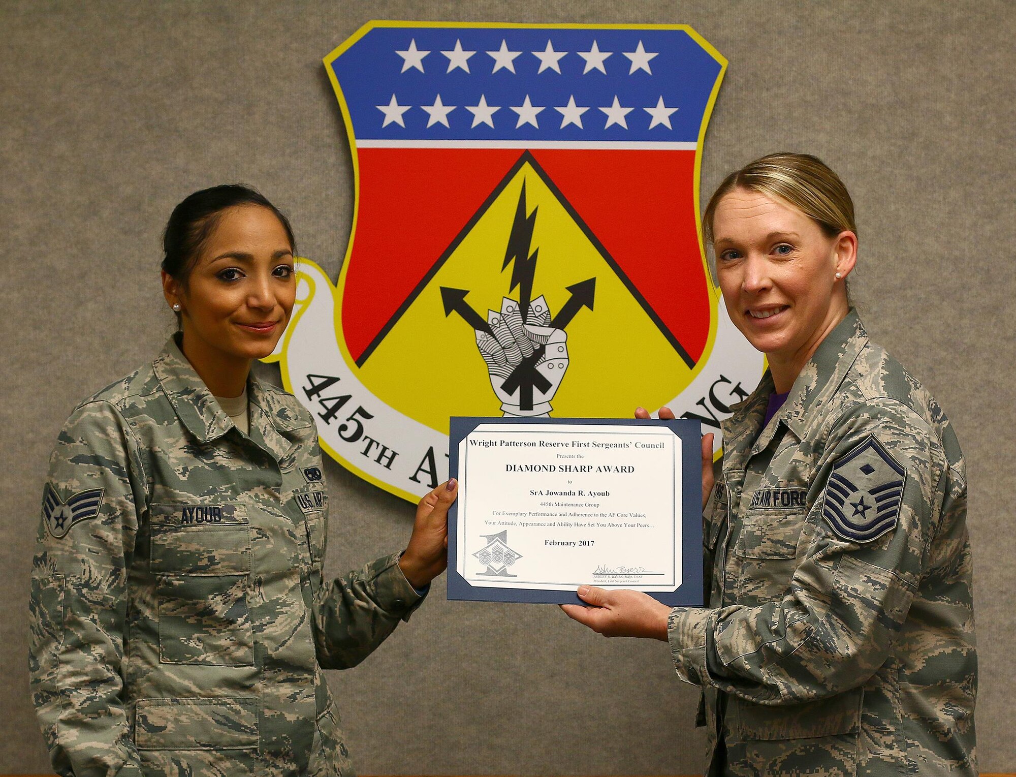 Master Sgt. Ashley Byers, 14th Intelligence Squadron first sergeant, presents the February 2017 Diamond Sharp Award to Senior Airman Jowanda Ayoub, 445th Maintenance Group, April 1, 2017. The award is for exemplary performance, adherence to Air Force Core Values, attitude, appearance and ability. (U.S. Air Force photo/Tech. Sgt. Patrick O’Reilly)