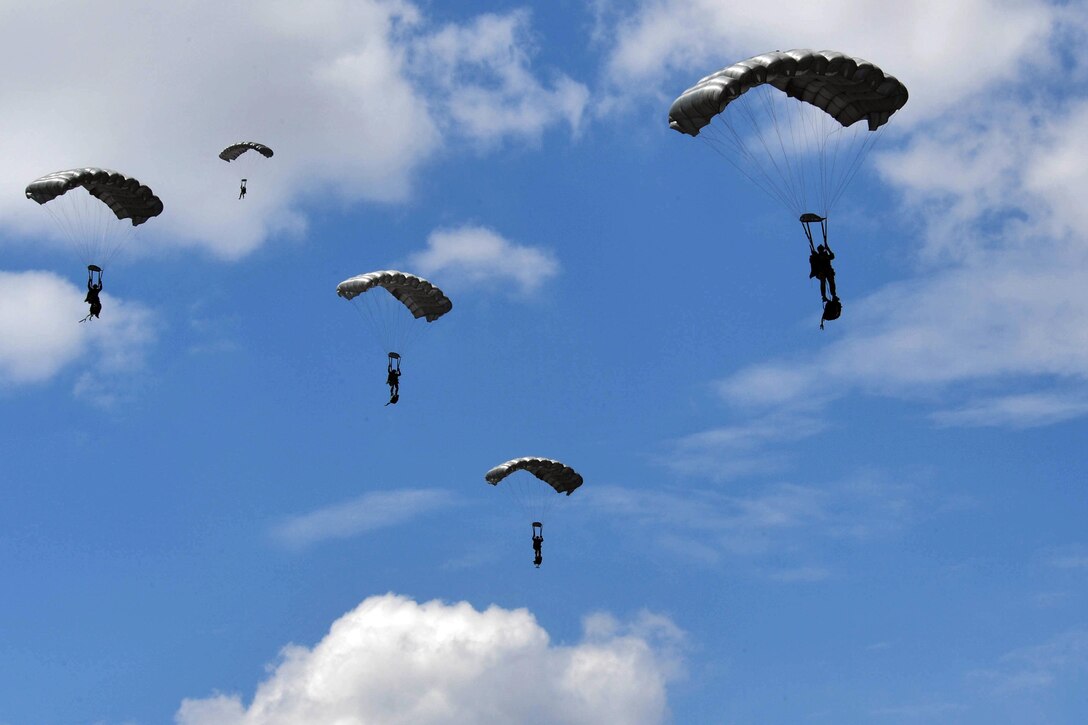 Five Greek paratroopers descend during a free-fall jump from a C-130J Super Hercules during Exercise Stolen Cerberus IV above Megara, Greece, April 22, 2017. The paratroopers descended from 10,000 feet. Air Force photo by Senior Airman Tryphena Mayhugh