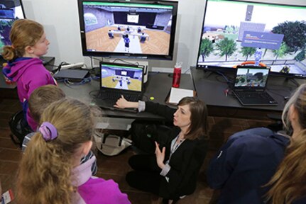 During the annual Bring A  Child to Work Day on April 20, a NUWC Division Newport employee gives a demonstration entitled “A Look at Virual Worlds” in the Rapid Innovation Center.