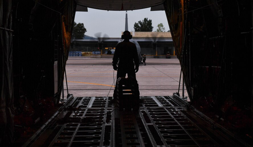 U.S. Air Force Master Sgt. CJ Campbell, 37th Airlift Squadron aircraft loadmaster, watches aircrew members ready a C-130J Super Hercules for departure during Exercise Stolen Cerberus IV at Elefsis Air Base, Greece, April 21, 2017. Campbell and other loadmasters prepared three C-130s for personnel and cargo drops. As NATO allies, the U.S. and Greece share a commitment to promote peace and stability, and seek opportunities to continue developing their strong relationship. (U.S Air Force photo by Senior Airman Tryphena Mayhugh)