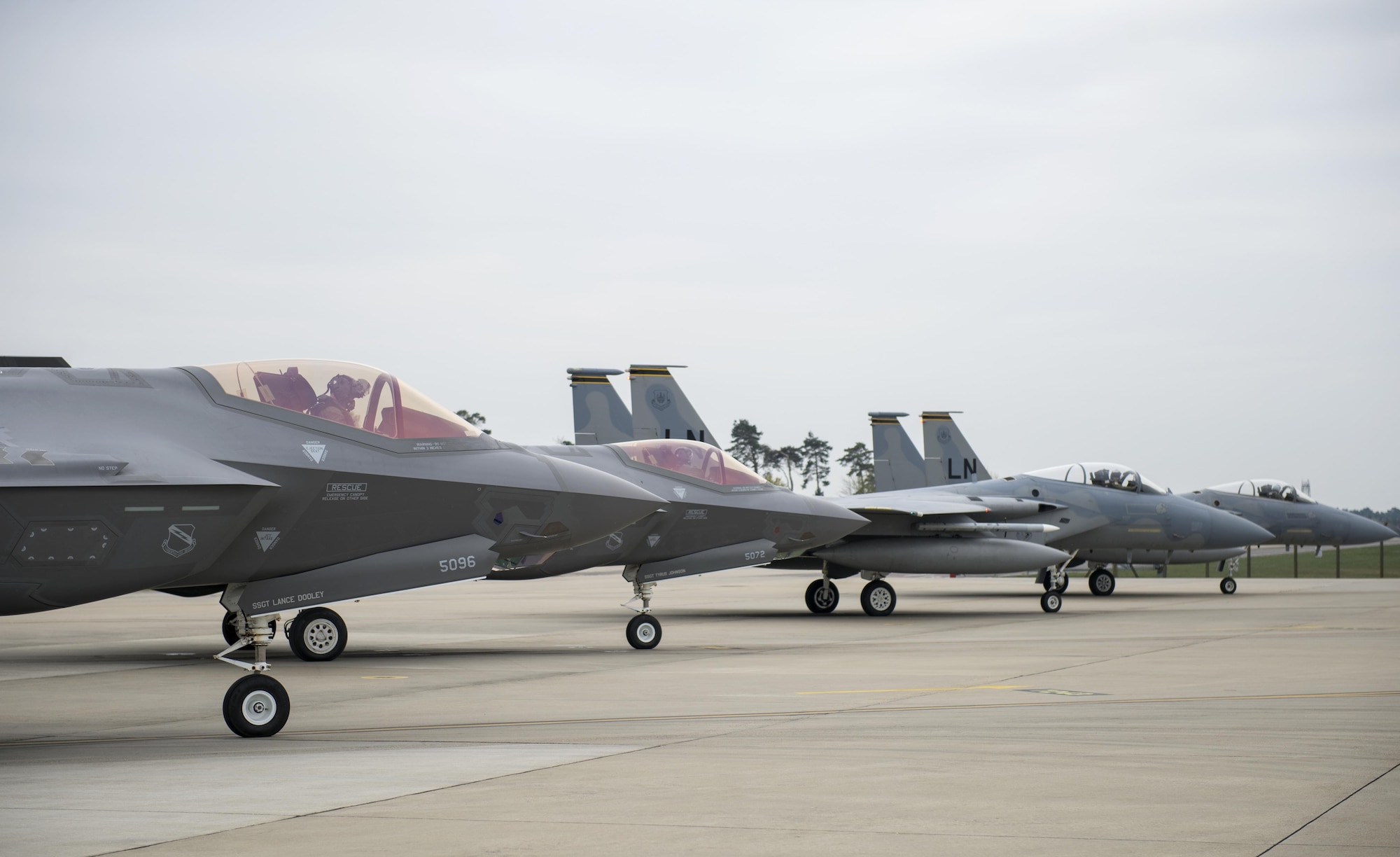 F-35A Lightning IIs from the 34th Fighter Squadron at Hill Air Force Base, Utah, and F-15C Eagles from the 493rd Fighter Squadron, stand by to take-off for a training sortie at Royal Air Force Lakenheath, England, April 20. The F-35A is a fifth generation fighter that provides the joint warfighter unprecedented global precision attack capability against current and emerging threats, while complementing the Air Force’s air superiority fleet. (U.S. Air Force photo/Staff Sgt. Emerson Nuñez)